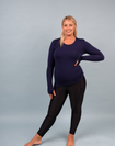 happy, fit mother wearing long sleeve blue bamboo top