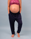 front view of a fit mother wearing navy bamboo jogger trousers