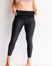 Active mother wearing black high waisted maternity leggings with pockets