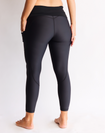 Back view of black high waisted maternity leggings with pockets in 7/8 length