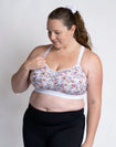 Happy active mum wearing maternity sports bra for large cup sizes