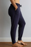 side view of a active mum wearing navy bamboo jogger trousers