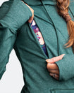 Nursing zip function on a green activewear hoodie
