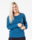 navy maternity top with long sleeves and invisible zip unzipped to breastfeed